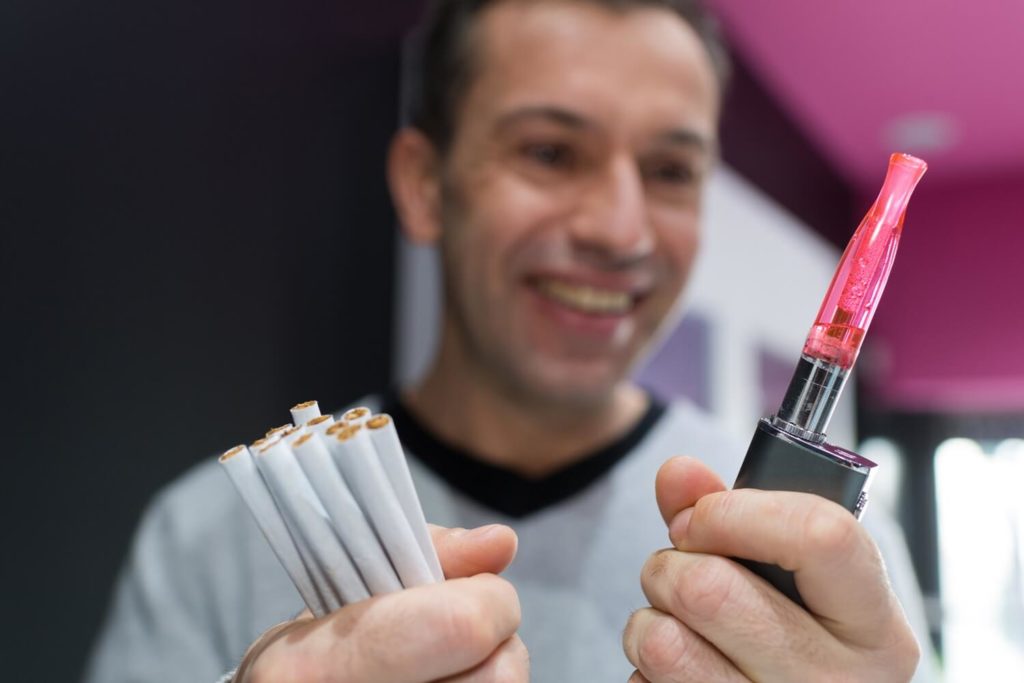 Man switching cigarettes for a vaping kit